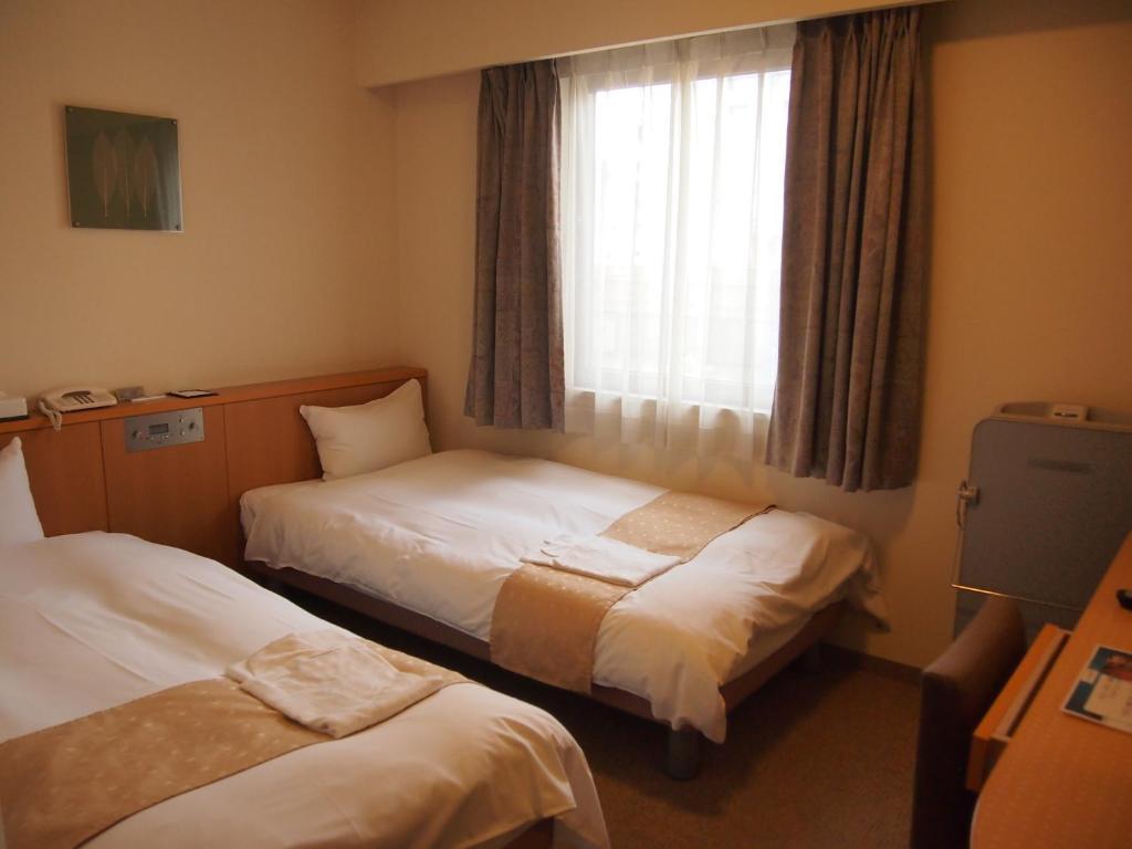 Nest Hotel Kumamoto Quarto foto